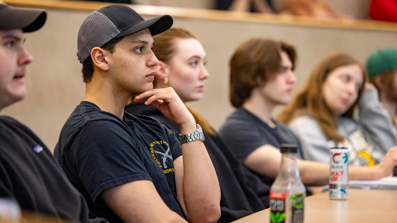 A group of students looking forward off camera