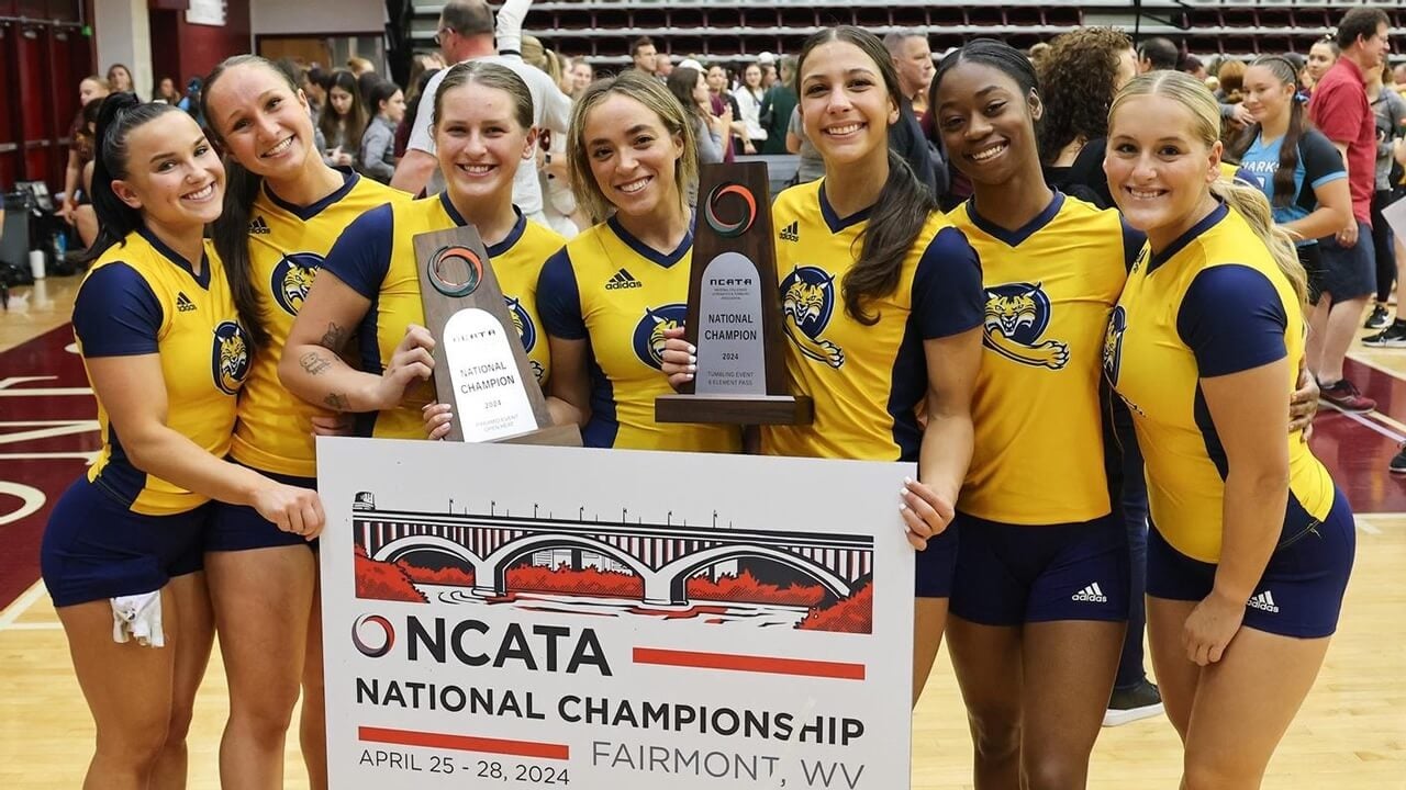 The Acrobatics and Tumbling team stand with their trophies.