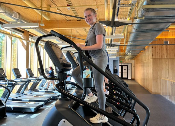 Student walks on a StairMaster in the Mount Carmel Recreation and Wellness Center