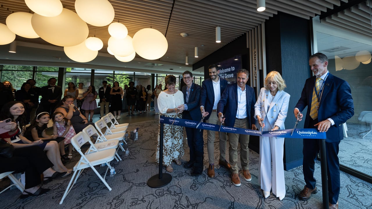 President Olian and other senior leaders cut the ribbon to open The Grove residence hall.