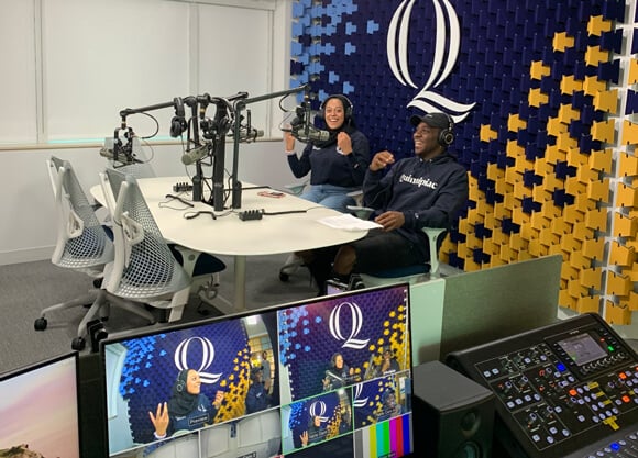 Two communications students record an episode in the Quinnipiac podcast studio