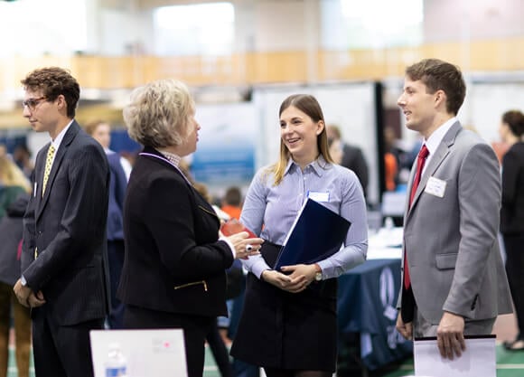 Students speaking to recruiters at the University-Wide Career Fair held in the Athletic and Recreation Center.